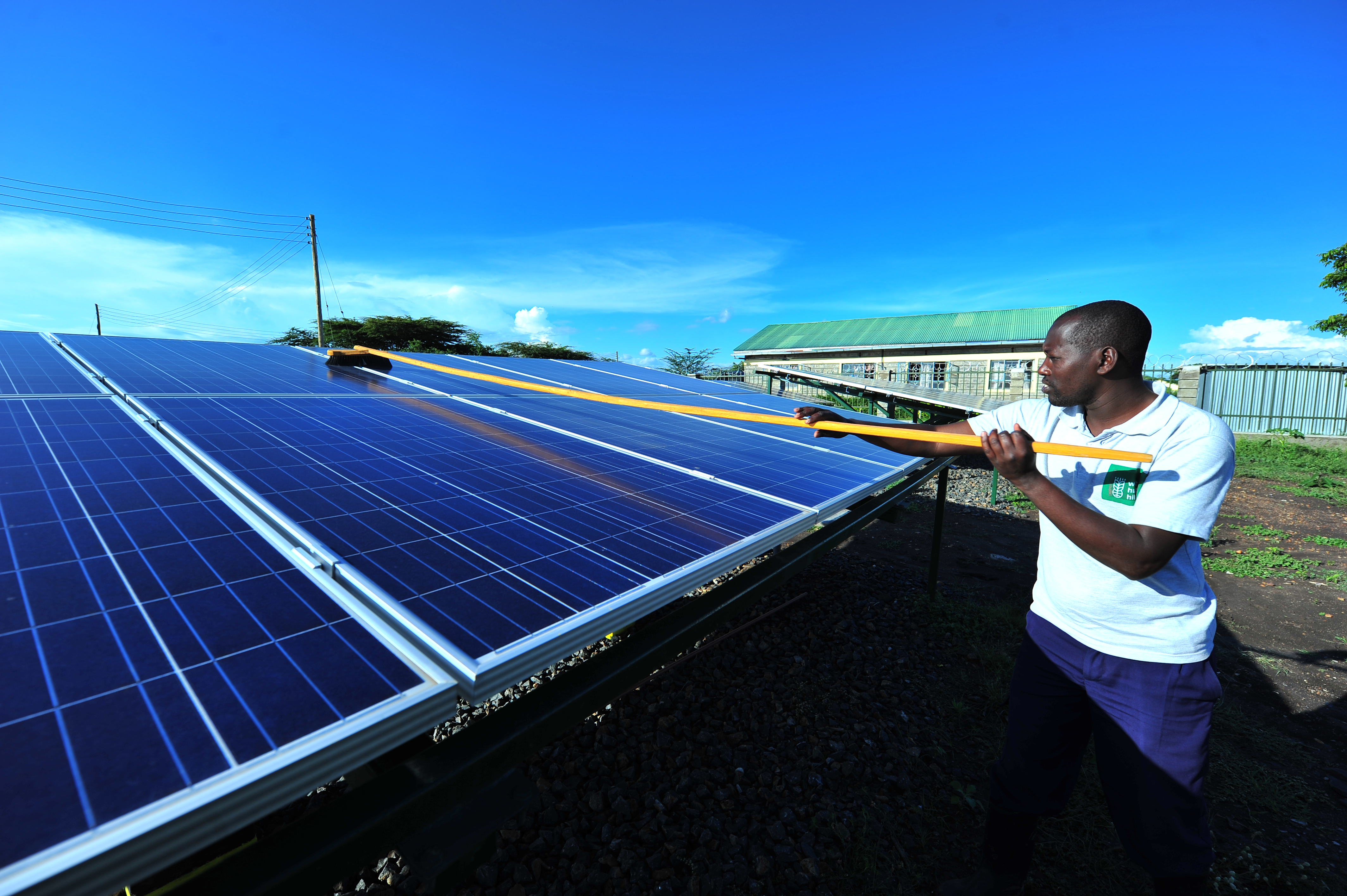 Silandoi Matikoi caretaker of Talek Solar Power Plant in Narok County, Kenya cleans the solar panels used to supply power to the residents of Talek town. Constructed with the help of the German government, the power plant will supply clean green power to the residents of Talek who are not connected to the National power grid