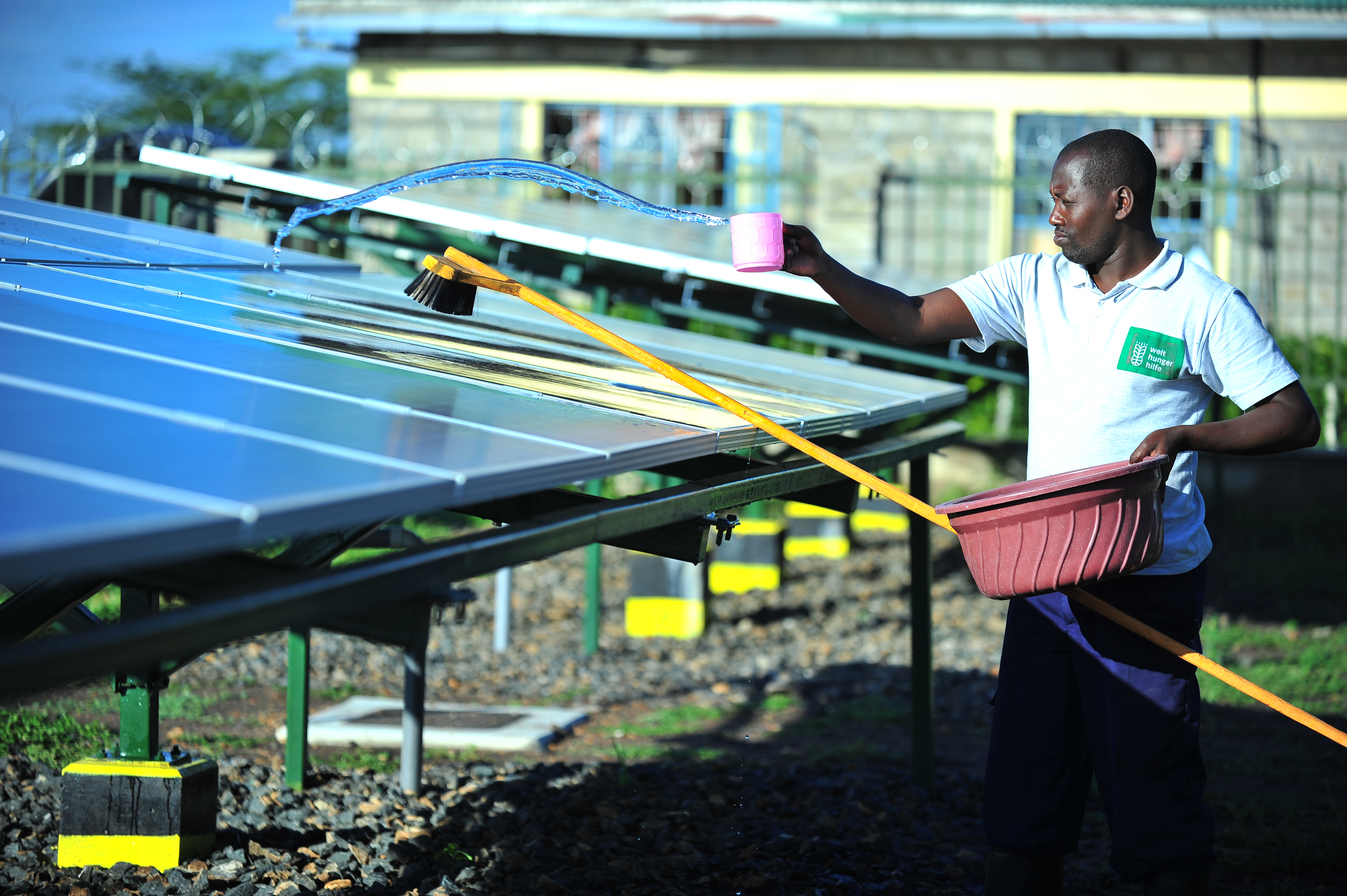 Silandoi Matikoi caretaker of Talek Solar Power Plant in Narok County, Kenya cleans the solar panels used to supply power to the residents of Talek town. Constructed with the help of the German government, the power plant will supply clean green power to the residents of Talek who are not connected to the National power grid