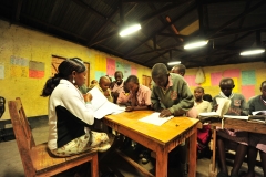 Class teacher Maria marks her pupils' books during night preps at Talek mixed day and boarding primary school. The school relies on its' solar panels for lighting especially after sunset because Talek town is not connected to the national power grid. Residents and business owners in Talek have had to rely on alternative power sources but this is set to change with the Talek Solar Powered Mini Grid. Through Talek Power, GIZ and other partners have constructed a solar power grid which will connect residents of Talek town in Narok to power for domestic and commercial use.